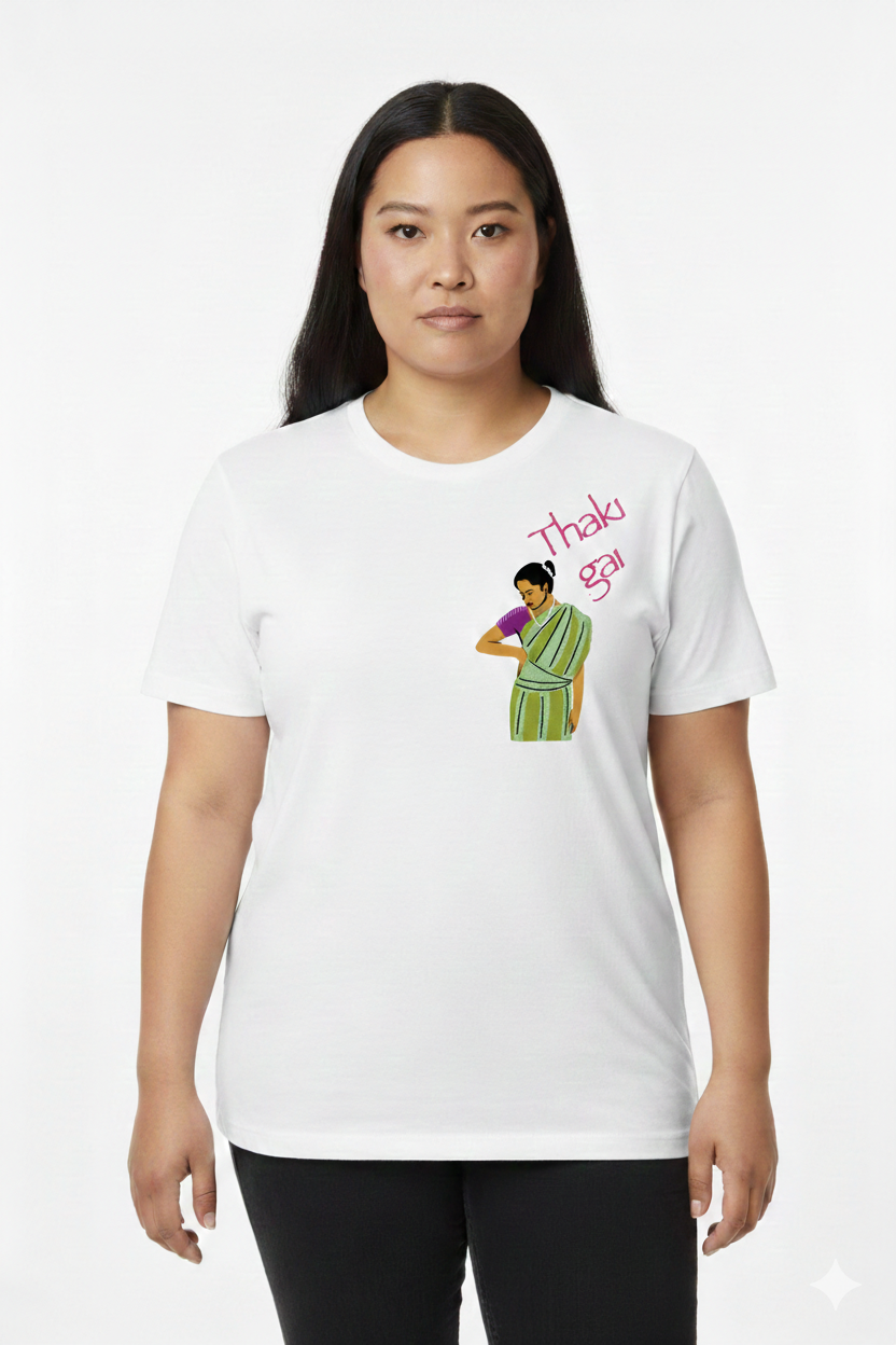 Woman wearing a white t-shirt with a Thaki Gai graphic design on left chest