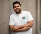 Man wearing a white t-shirt with a  Kaam Chor graphic design on left chest