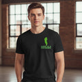 Man wearing a black t-shirt with a Cool as a Cucumber graphic design on left chest