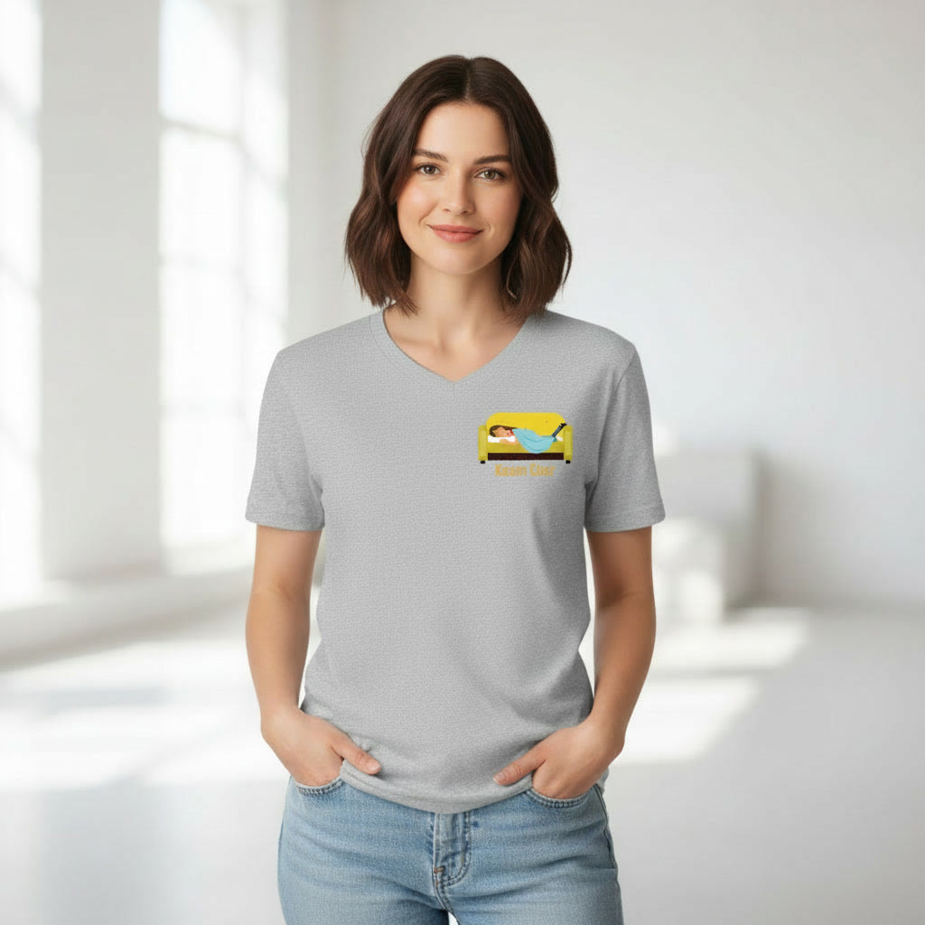 Woman wearing a grey t-shirt with a  Kaam Chor graphic design on left chest