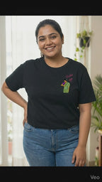 Woman wearing a black t-shirt with a Thaki Gai graphic design on left chest - video